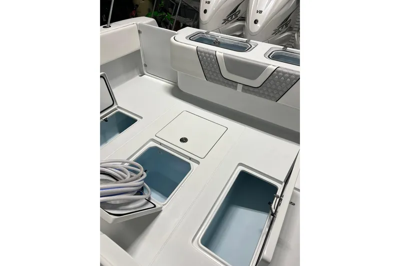 Dig It Yacht Photos Pics 2022 Contender 39 ST boat deck with storage compartments and coiled rope.