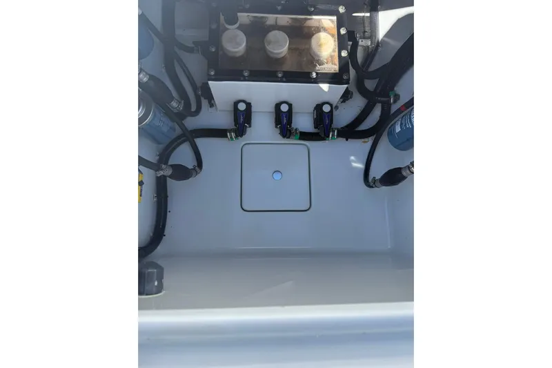 Dig It Yacht Photos Pics 2022 Contender 39 ST boat interior showing engine compartment and wiring.