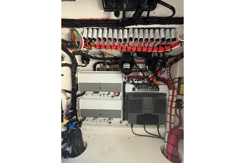 Dig It Yacht Photos Pics Electrical system of 2022 Contender 39 ST boat, featuring organized wiring and components.