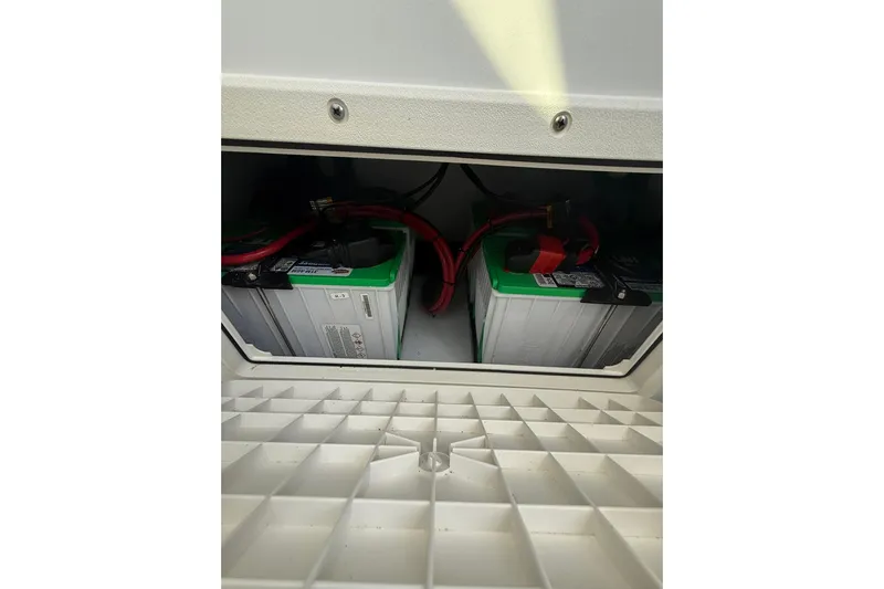 Dig It Yacht Photos Pics Battery compartment of 2022 Contender 39 ST boat with visible wiring.