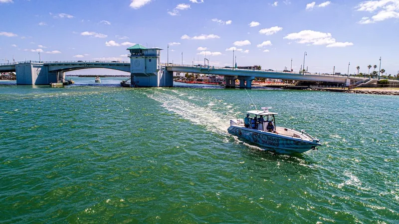  Yacht Photos Pics 2023 CG Boat Works 35 M-Series cruising under a sunny bridge.