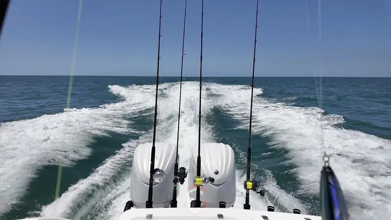  Yacht Photos Pics 2023 CG Boat Works 35 M-Series cruising on open ocean with fishing rods.