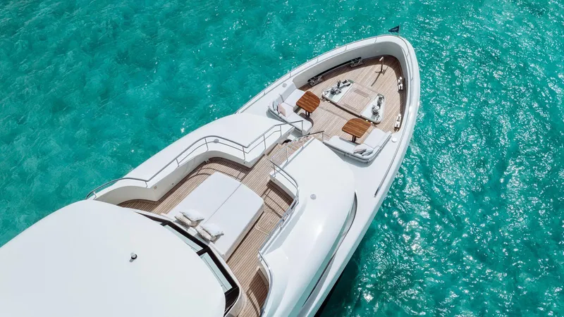 Midnight Saga Yacht Photos Pics Luxury Moonen 110 yacht on turquoise water, 2023 model, aerial view.