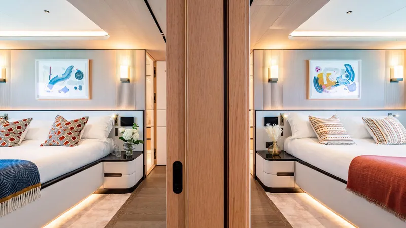 Midnight Saga Yacht Photos Pics Luxurious 2023 Moonen 110 yacht interior with elegant twin bedrooms and modern decor.