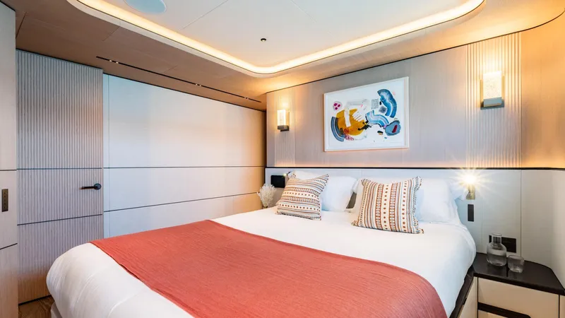 Midnight Saga Yacht Photos Pics Luxurious bedroom interior on 2023 Moonen 110 yacht, featuring modern design and elegant decor.