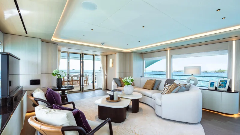 Midnight Saga Yacht Photos Pics Luxurious interior of 2023 Moonen 110 yacht with elegant seating and ocean view.