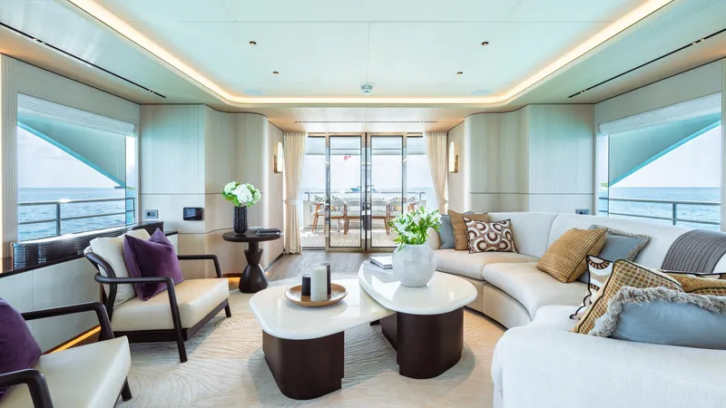 Midnight Saga Yacht Photos Pics Luxurious interior of 2023 Moonen 110 yacht with elegant seating and ocean view.