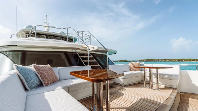 Midnight Saga Yacht Photos Pics Luxurious 2023 Moonen 110 yacht deck with elegant seating and ocean view.