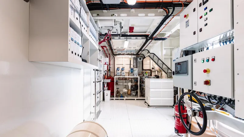 Midnight Saga Yacht Photos Pics Engine room of 2023 Moonen 110 yacht with control panels and equipment.