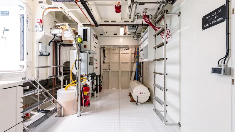 Midnight Saga Yacht Photos Pics Engine room of 2023 Moonen 110 yacht, featuring equipment and safety gear.