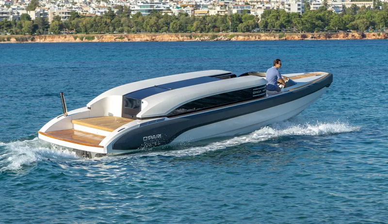  Yacht Photos Pics 2024 Onda 321 LIMO luxury boat cruising on clear blue water.