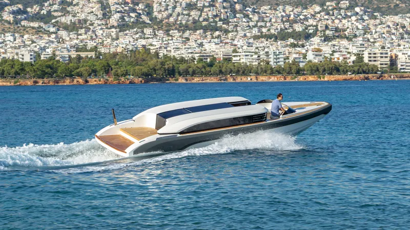  Yacht Photos Pics 2024 Onda 321 LIMO luxury boat cruising on a scenic coastal waterway.