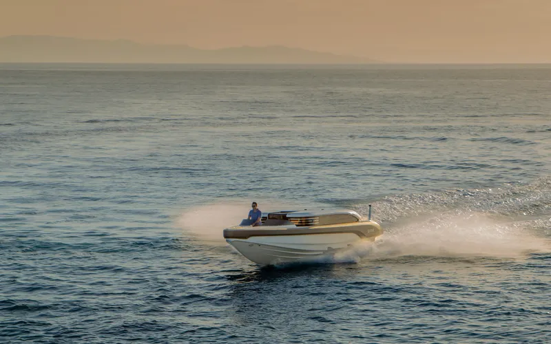  Yacht Photos Pics 2024 Onda 321 LIMO cruising on open sea at sunset.