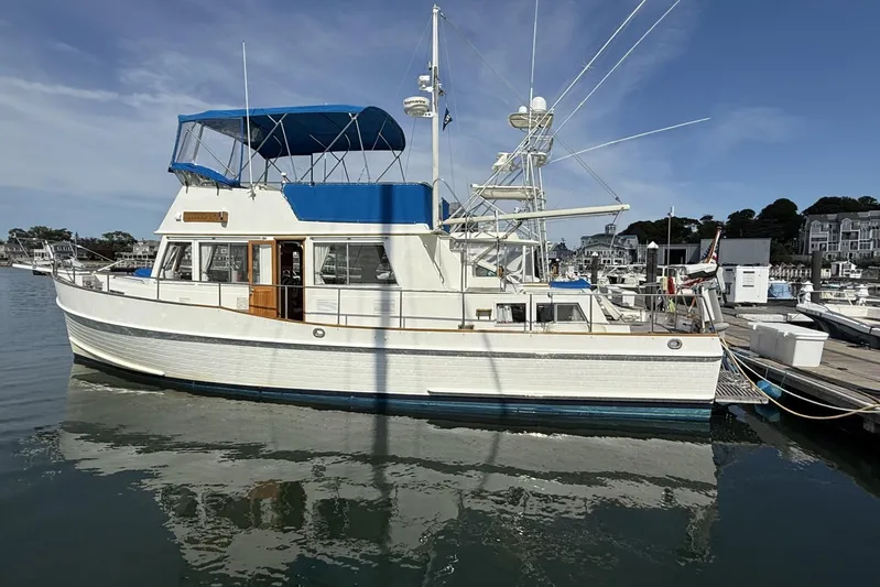  Yacht Photos Pics 1999 Grand Banks 42 Classic yacht docked at marina under clear blue sky.
