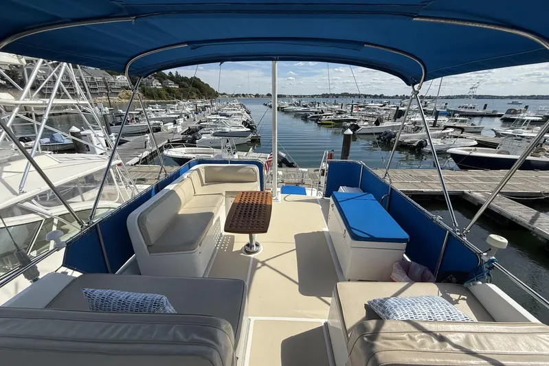  Yacht Photos Pics Flybridge view of 1999 Grand Banks 42 Classic yacht docked at marina.