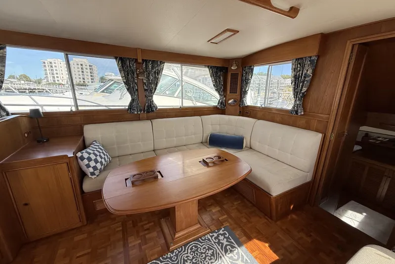  Yacht Photos Pics 1999 Grand Banks 42 Classic yacht interior with elegant wood finish and cozy seating area.