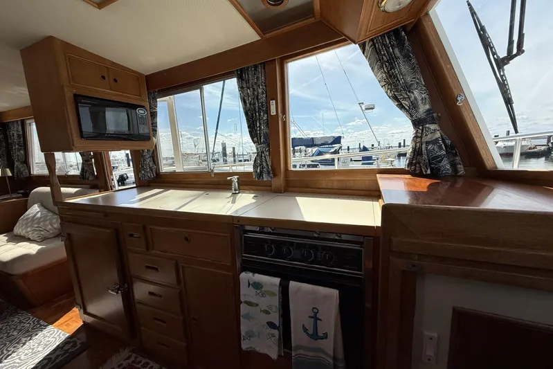  Yacht Photos Pics Interior of 1999 Grand Banks 42 Classic yacht with kitchen and marina view.