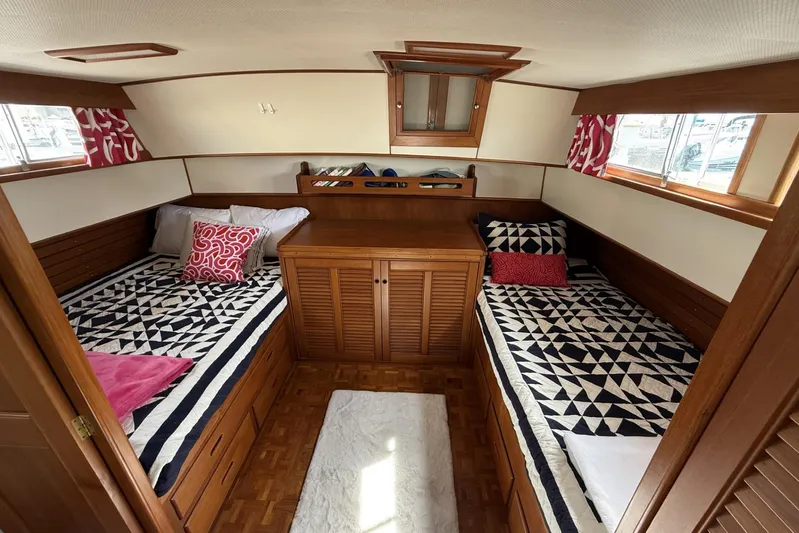  Yacht Photos Pics Cabin interior of 1999 Grand Banks 42 Classic with twin beds and nautical decor.