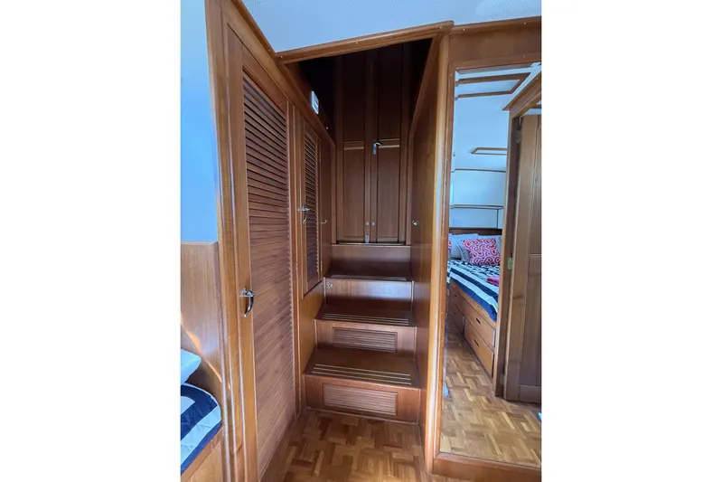  Yacht Photos Pics Interior of 1999 Grand Banks 42 Classic yacht with wooden stairs and cabinetry.