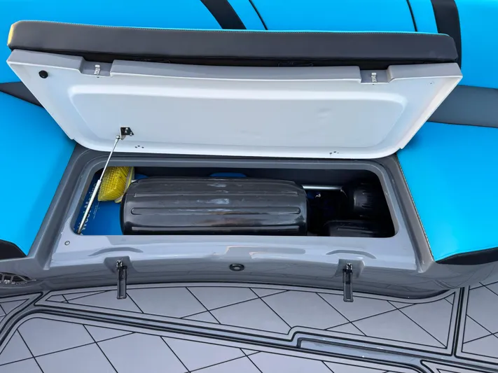 Do Better Yacht Photos Pics Open storage compartment on 2021 Midnight Express 37 Open boat, featuring blue seating and deck.