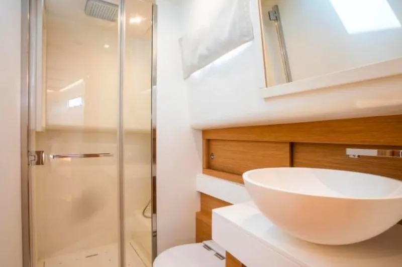  Yacht Photos Pics Modern bathroom interior of 2023 Pardo Yachts 50, featuring sleek shower and stylish sink.