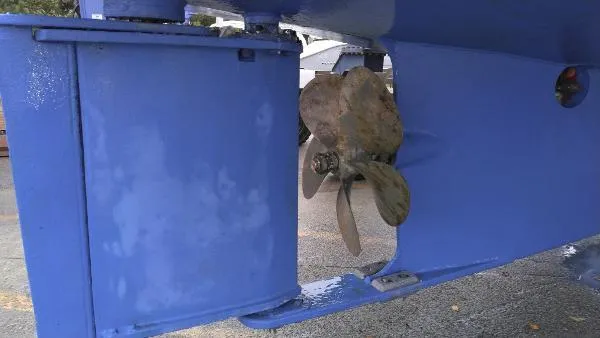Moondance Yacht Photos Pics Close-up of 2007 Custom Rockport Steel Trawler MY propeller and rudder.