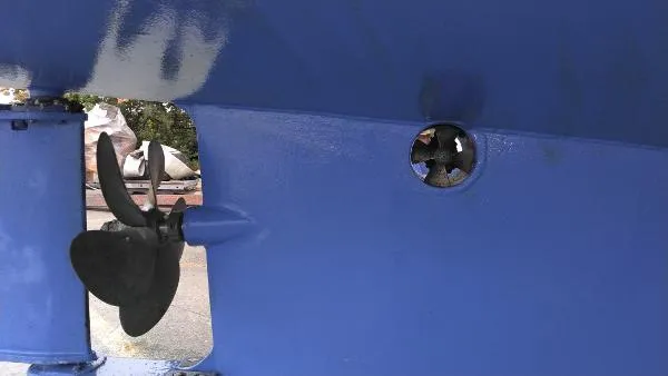 Moondance Yacht Photos Pics Close-up of the propeller and thruster on a 2007 Custom Rockport Steel Trawler MY.