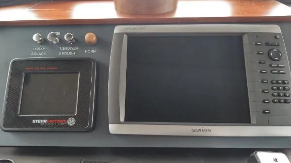 Moondance Yacht Photos Pics Control panel of a 2007 Custom Rockport Steel Trawler MY with Garmin display.