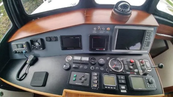 Moondance Yacht Photos Pics Control panel of a 2007 Custom Rockport Steel Trawler MY with navigation instruments.
