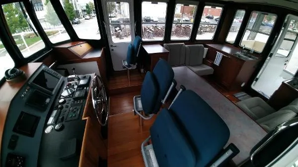 Moondance Yacht Photos Pics Interior of 2007 Custom Rockport Steel Trawler MY with helm, seating, and large windows.