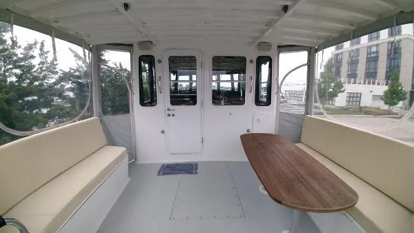 Moondance Yacht Photos Pics Interior of 2007 Custom Rockport Steel Trawler MY with seating and table.