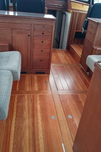 Moondance Yacht Photos Pics Interior of 2007 Custom Rockport Steel Trawler MY with wooden flooring and cabinetry.