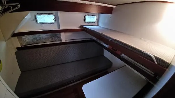 Moondance Yacht Photos Pics Interior cabin of 2007 Custom Rockport Steel Trawler MY with bunk beds and seating.