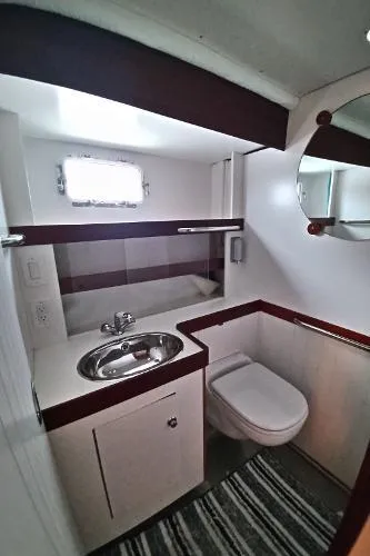 Moondance Yacht Photos Pics 2007 Custom Rockport Steel Trawler MY bathroom with sink, toilet, and mirror.