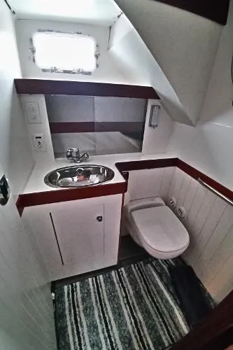 Moondance Yacht Photos Pics 2007 Custom Rockport Steel Trawler MY bathroom with sink, toilet, and window.
