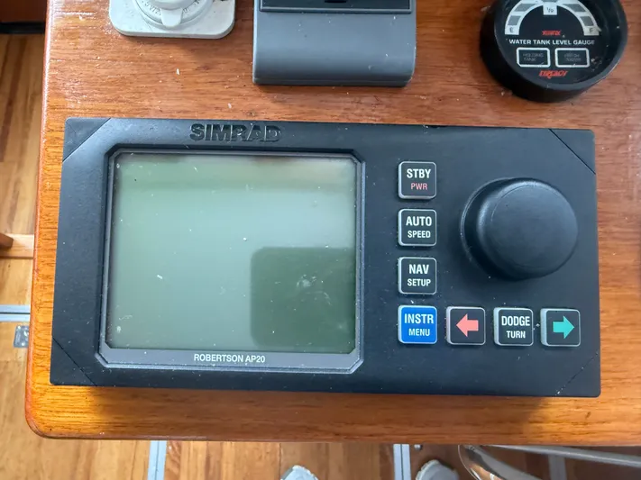 Screamer Yacht Photos Pics Simrad Robertson AP20 autopilot control on 1998 Wilbur 38 Downeast boat dashboard.
