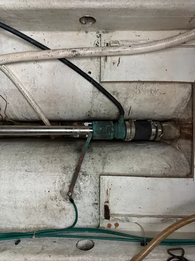 Screamer Yacht Photos Pics Engine compartment of a 1998 Wilbur 38 Downeast boat, showing mechanical components and wiring.