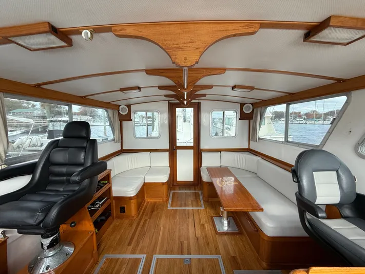 Screamer Yacht Photos Pics Interior of 1998 Wilbur 38 Downeast boat with wood accents and seating.