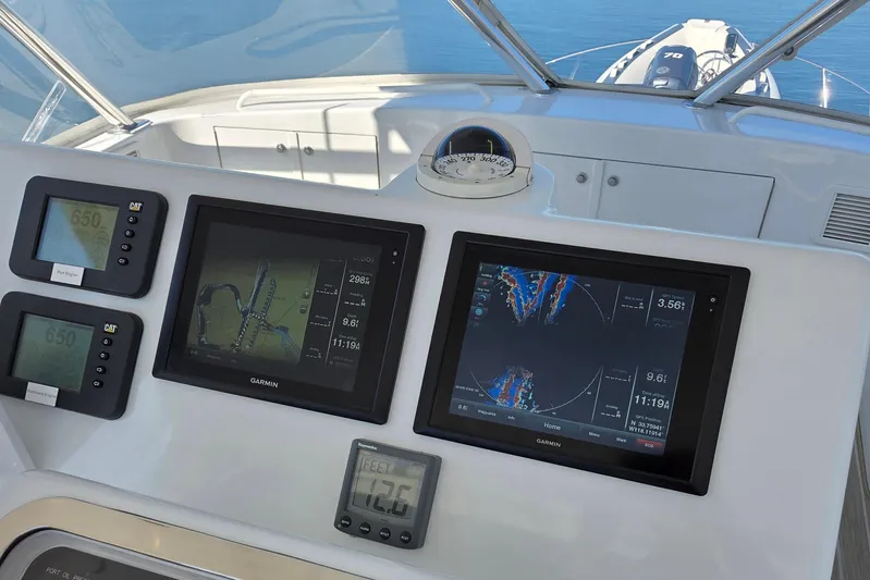  Yacht Photos Pics Hatteras 50 Convertible 2006 dashboard with Garmin navigation displays and controls.