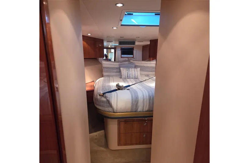  Yacht Photos Pics Luxurious cabin interior of 2006 Hatteras 50 Convertible yacht with cozy bedding.
