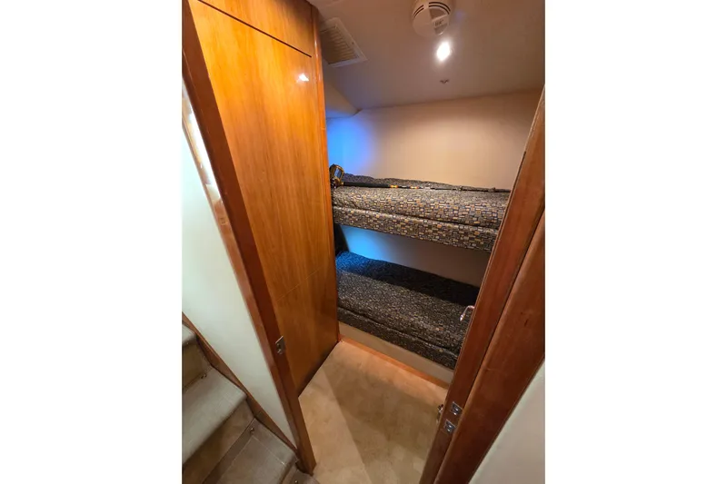  Yacht Photos Pics Bunk beds in 2006 Hatteras 50 Convertible yacht cabin with wooden interior.