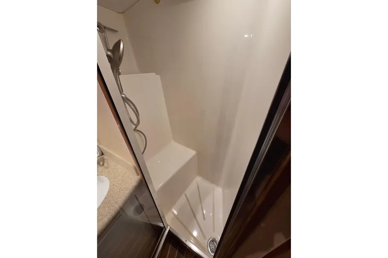  Yacht Photos Pics Shower area in 2006 Hatteras 50 Convertible yacht, featuring modern fixtures and sleek design.