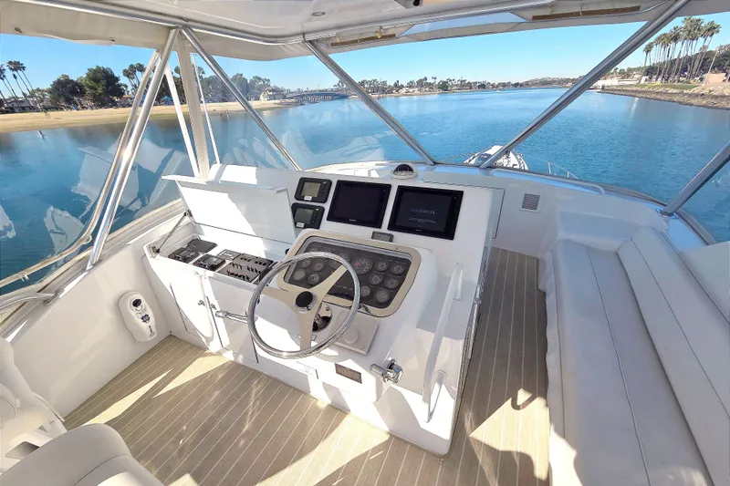  Yacht Photos Pics Helm of 2006 Hatteras 50 Convertible yacht with dual screens and steering wheel.