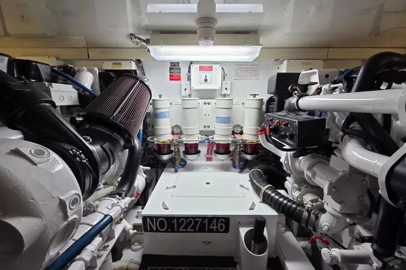  Yacht Photos Pics Engine room of 2006 Hatteras 50 Convertible yacht, showcasing mechanical components and systems.