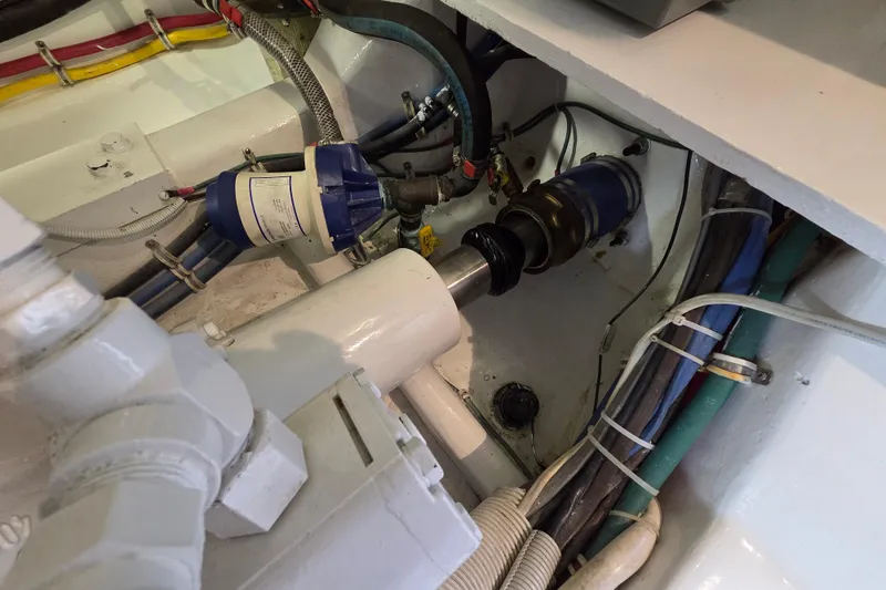  Yacht Photos Pics Engine room of 2006 Hatteras 50 Convertible with visible mechanical components and wiring.