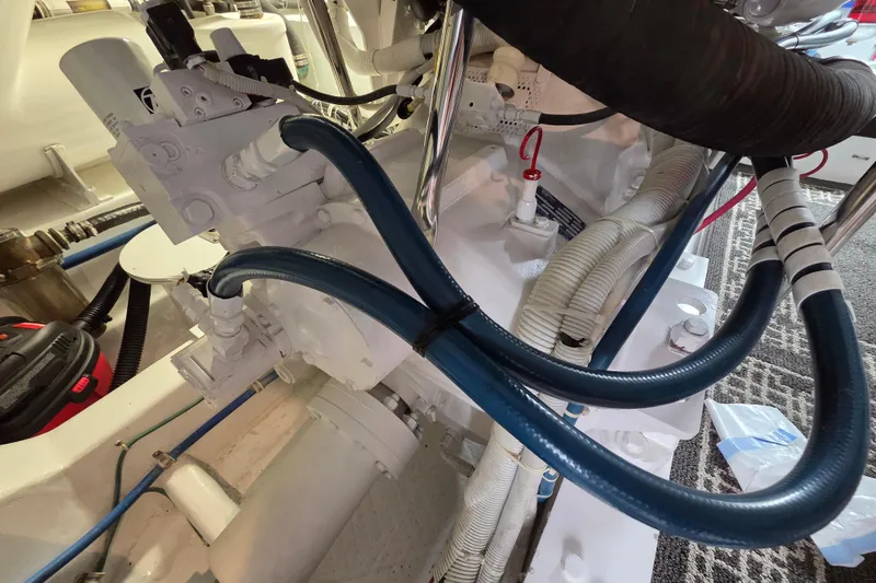  Yacht Photos Pics Engine room of 2006 Hatteras 50 Convertible with hydraulic and electrical components.