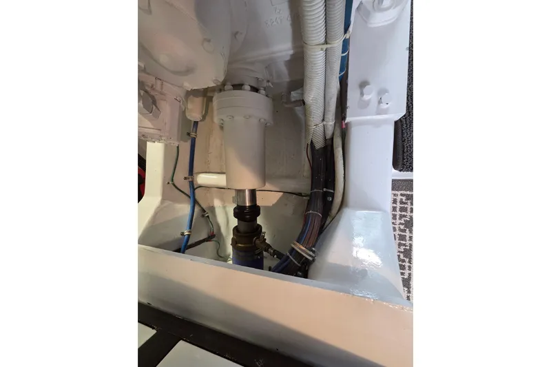  Yacht Photos Pics Engine compartment of 2006 Hatteras 50 Convertible boat, showing mechanical components and wiring.