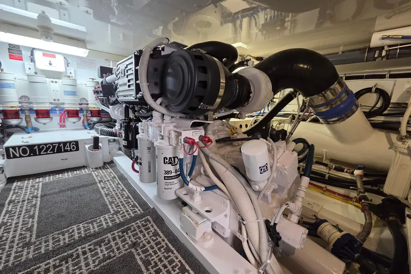  Yacht Photos Pics Engine room of 2006 Hatteras 50 Convertible yacht, featuring CAT marine engine.
