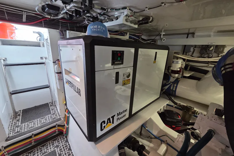  Yacht Photos Pics Engine room of 2006 Hatteras 50 Convertible with Caterpillar marine power generator.