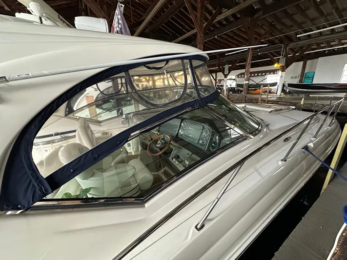  Yacht Photos Pics 2007 Sea Ray 44 Sundancer yacht in a marina, showcasing sleek design and luxurious interior.